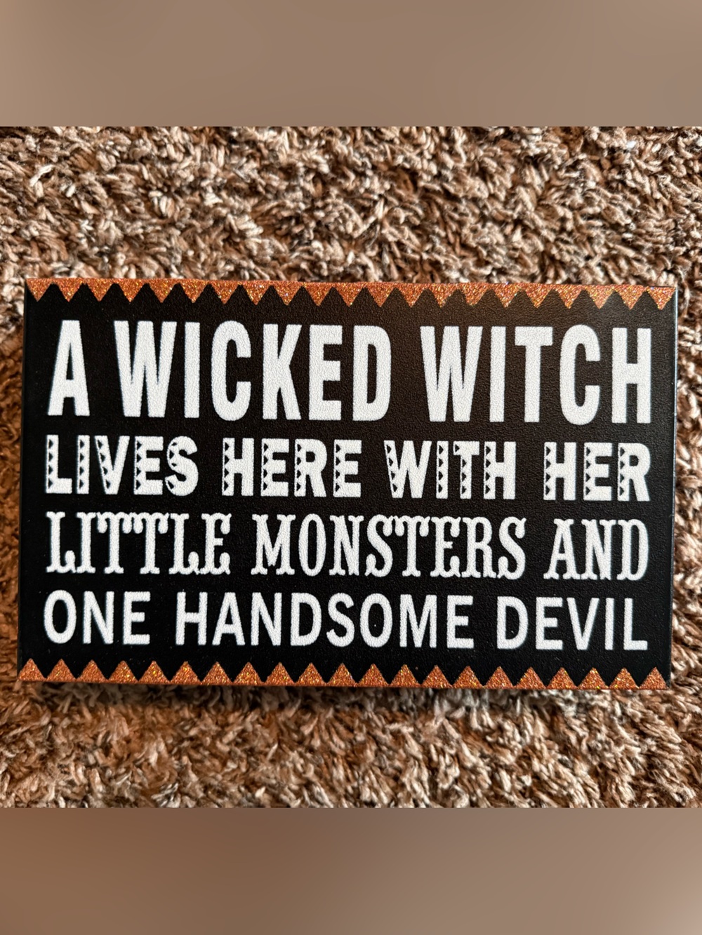Black and Orange 'A Wicked Witch Lives Here' Decorative Wall Plaque